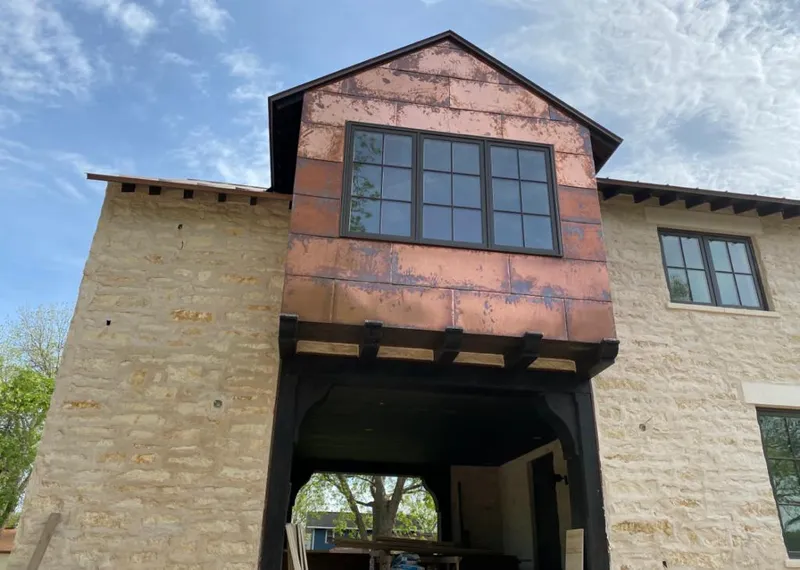 Copper metal panel facade on a stone building for Metal Roof Coating in Valley Park