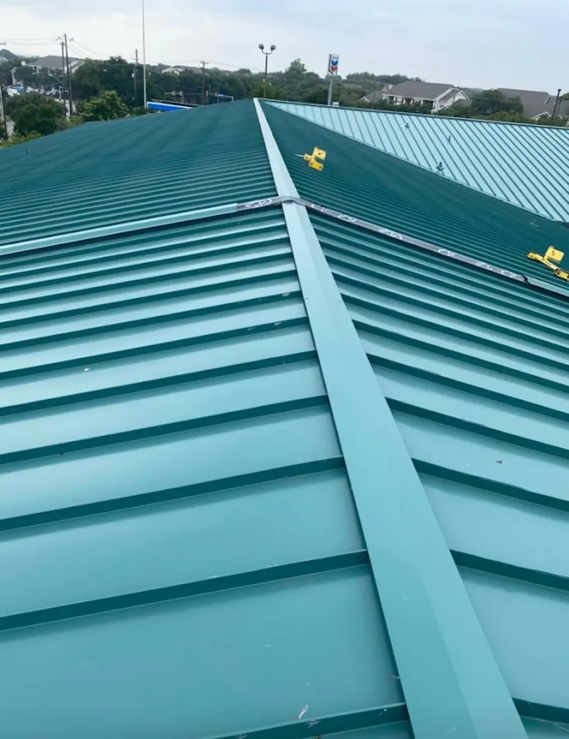 Green commercial metal roof ridge and valley for Metal Roof Repair in Valley Park